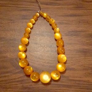 Unique gold beaded necklace